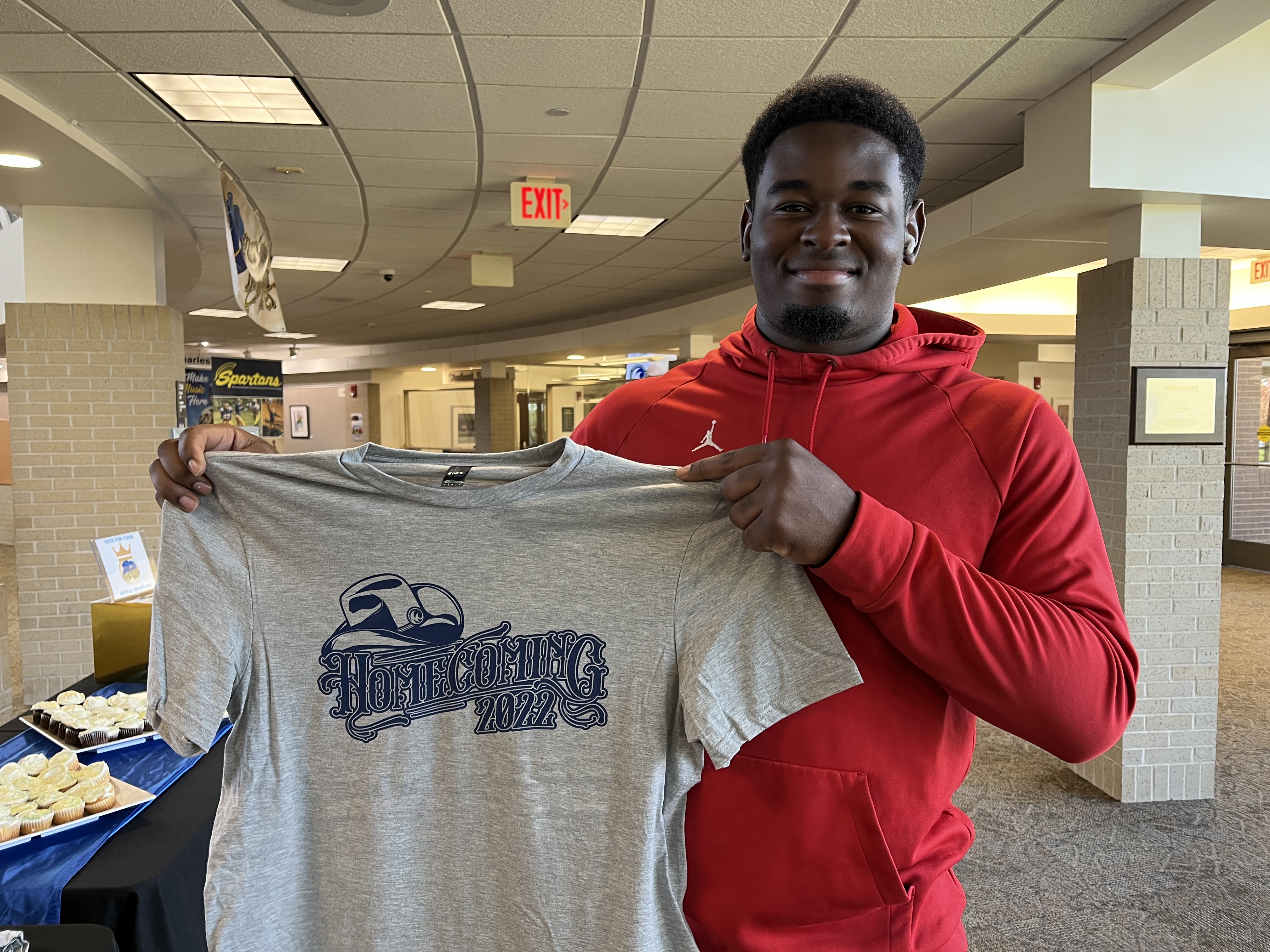 Noel Kabanga picks up his Homecoming t-shirt at M State's Fergus Falls campus on September 26, 2022