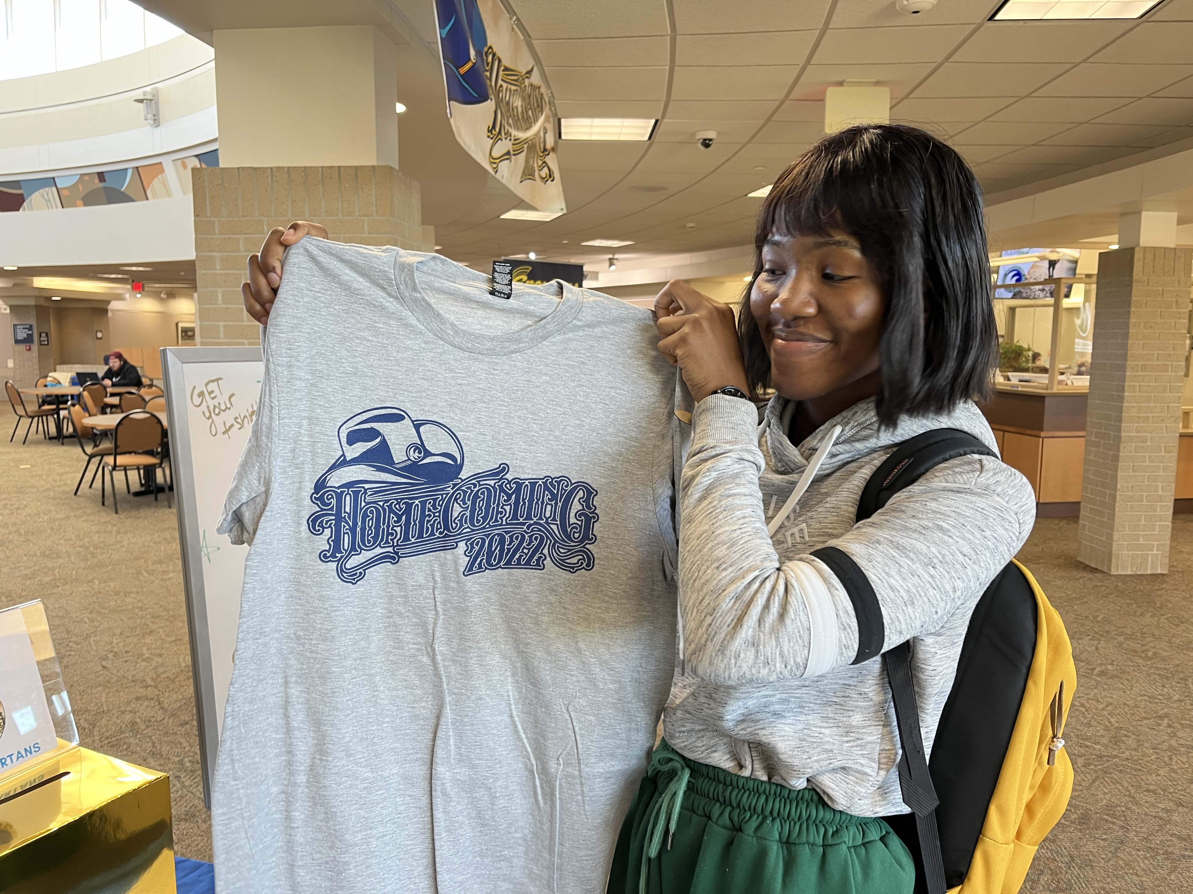Sabing Menop picking our her Homecoming t-shirt at Spirit Central on the M State Fergus Falls campus