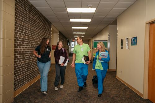 Students walk down a hallway in Moorhead