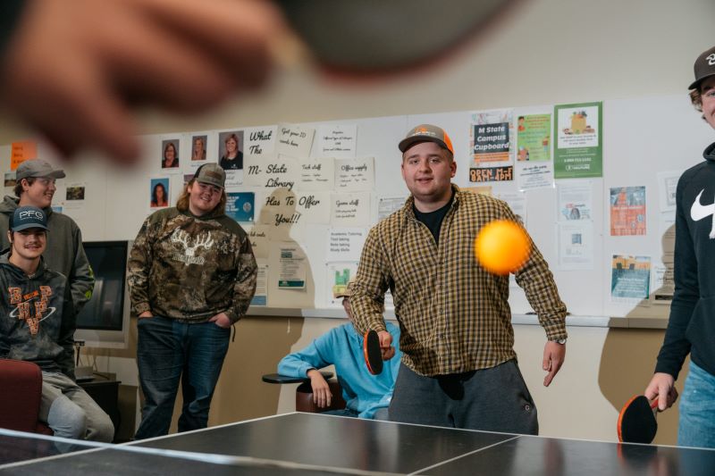 Students play a round of ping pong on the Wadena campus