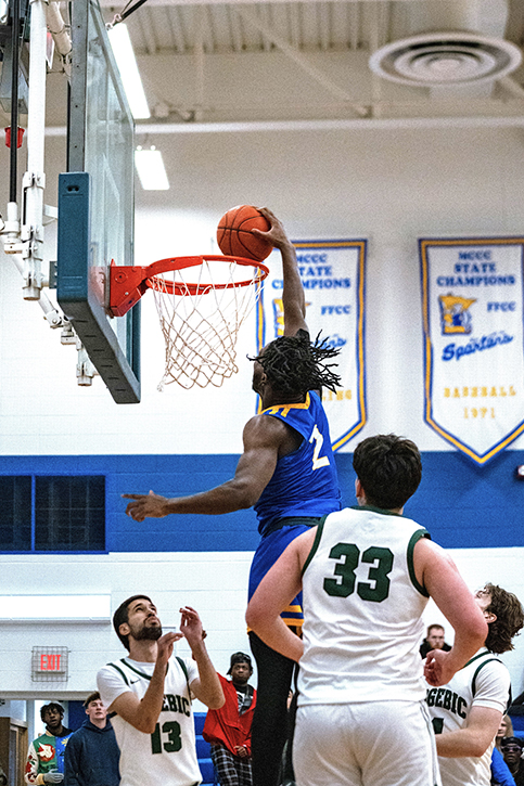 Foday Sheriff makes a basket during a men's basketball game in the 2024-2025 season at M State.