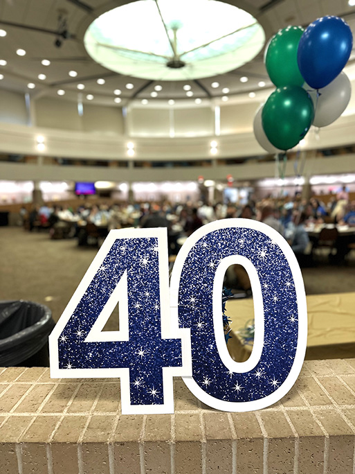 A number 40 decoration on top of a brick half wall surrounding the celebration area