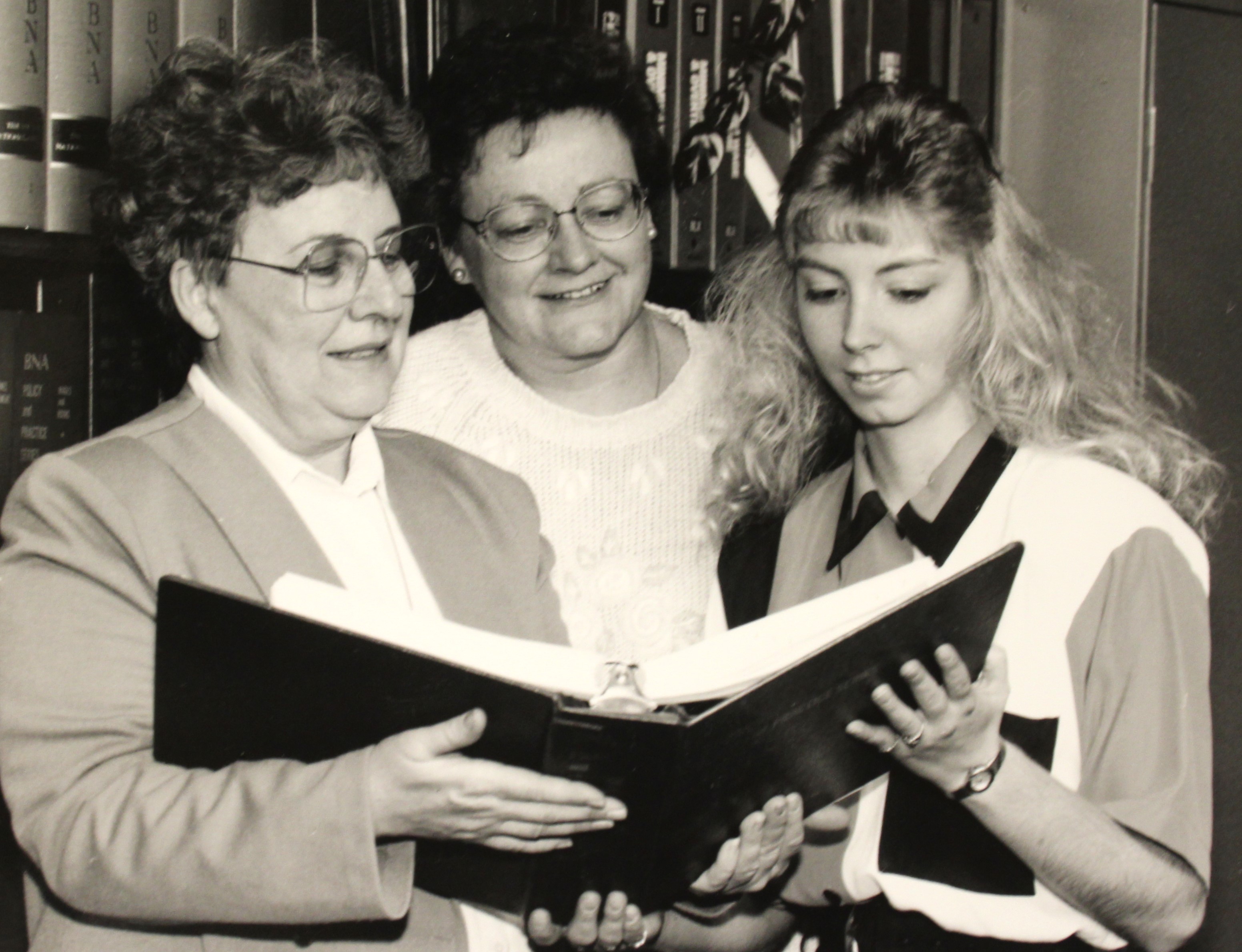 Three employees of the Wadena college, on campus in 1994