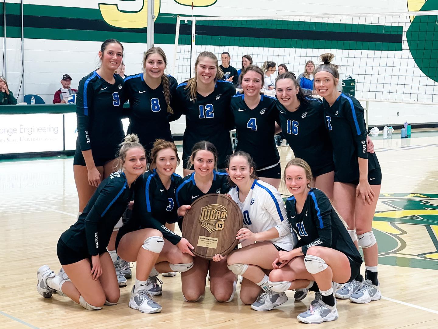 The 2022 Spartan Volleyball team, with their regional championship award