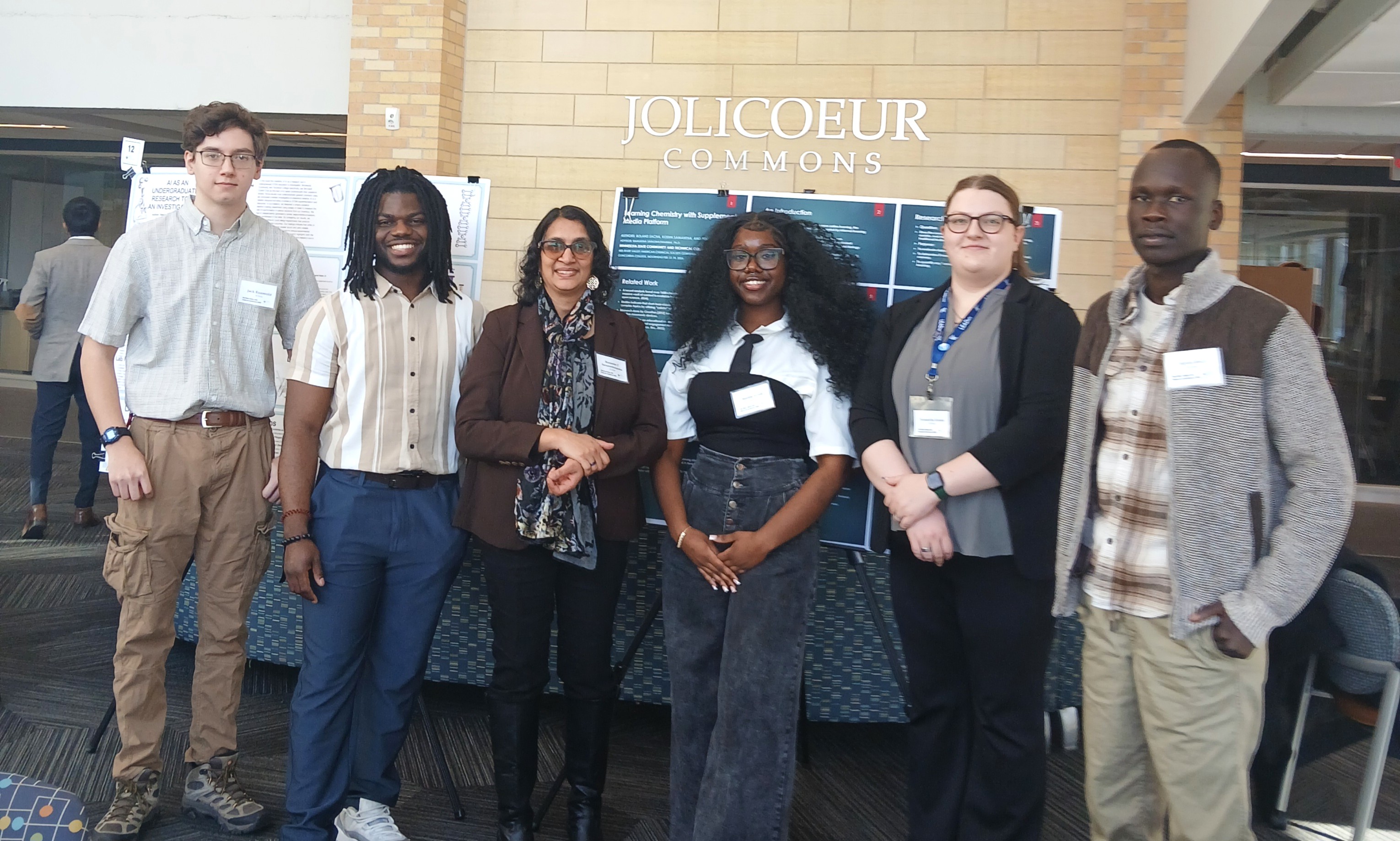 Five M State chemistry students pose with their instructor at a research conference at Concordia College in Moorhead.