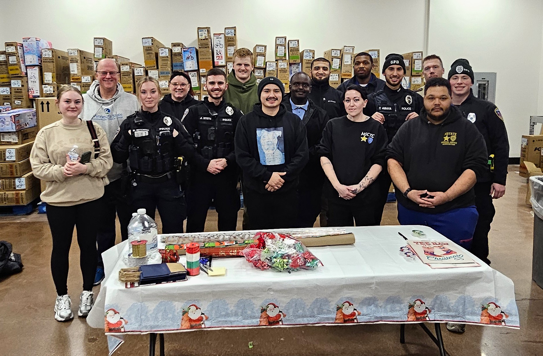 Past and present M State Criminal Justice students helped wrap holiday gifts at this year's "Shop With a Cop" event at the Dilworth Walmart.