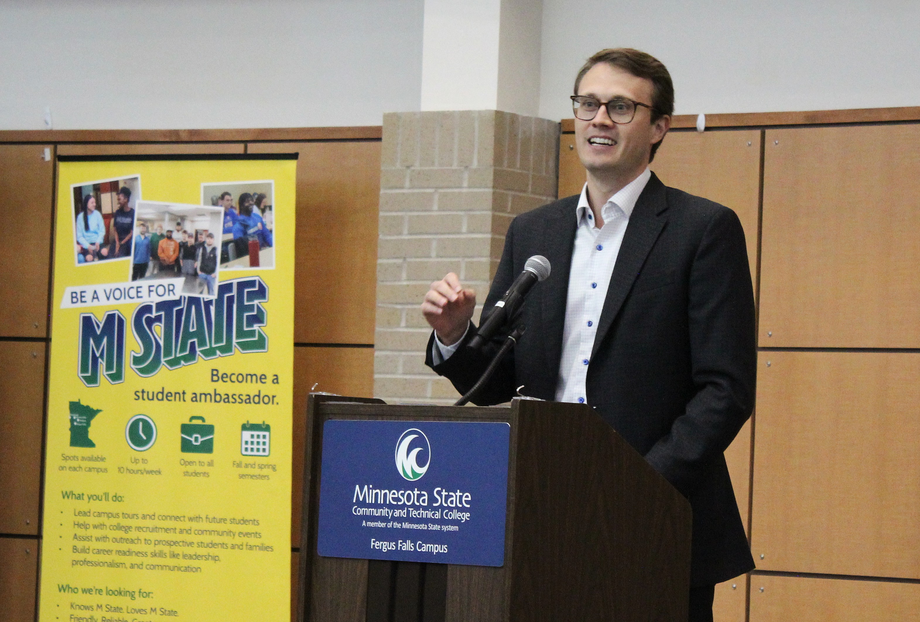 State Senator Jordan Rasmusson speaks at the podium at M State's Fergus Falls campus, in Legacy Hall in the fall of 2026.
