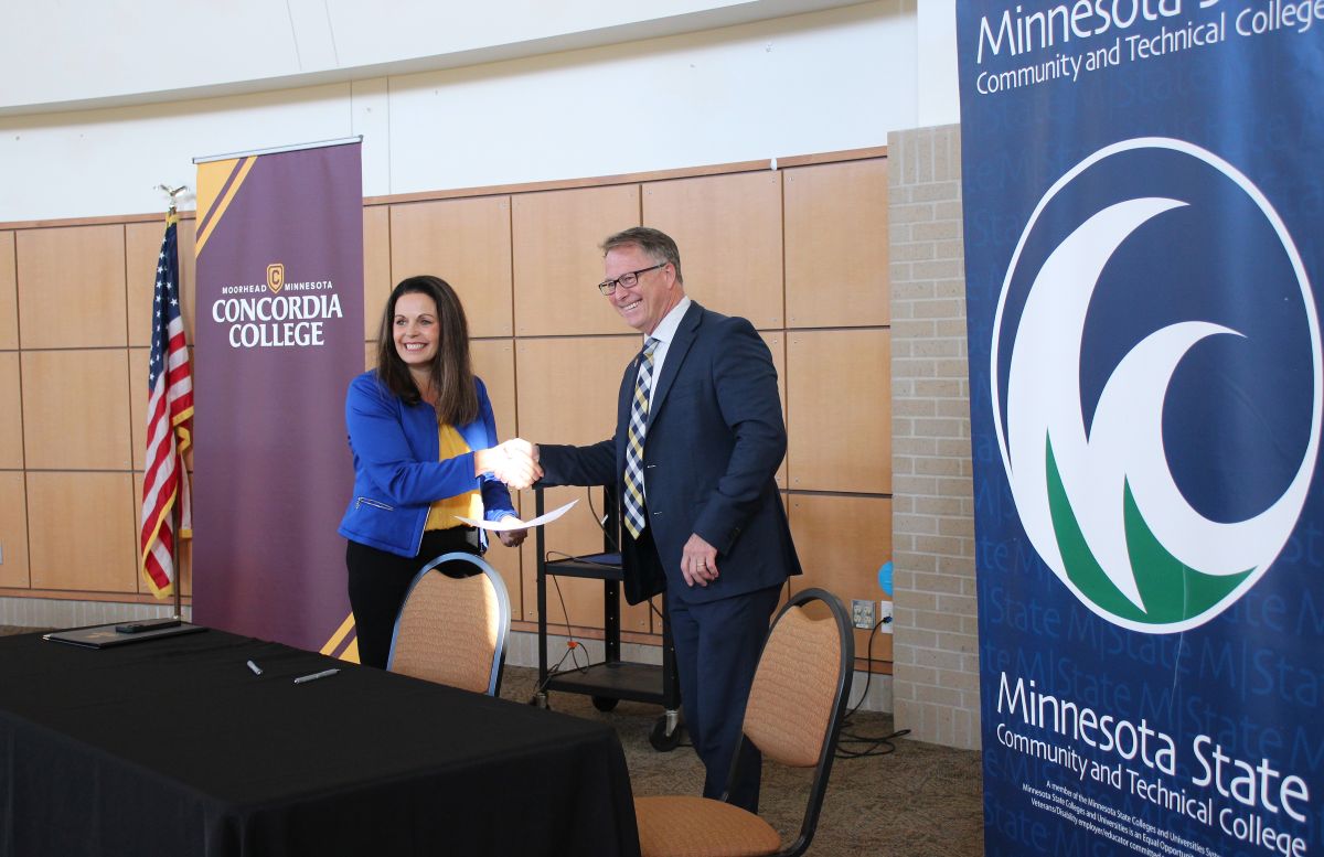 M State President Carrie Brimhall and Concordia College President Colin Irvine shake hands after signing a Memorandum of Understanding at a special event on the M State Fergus Falls campus on September 9, 2026. 