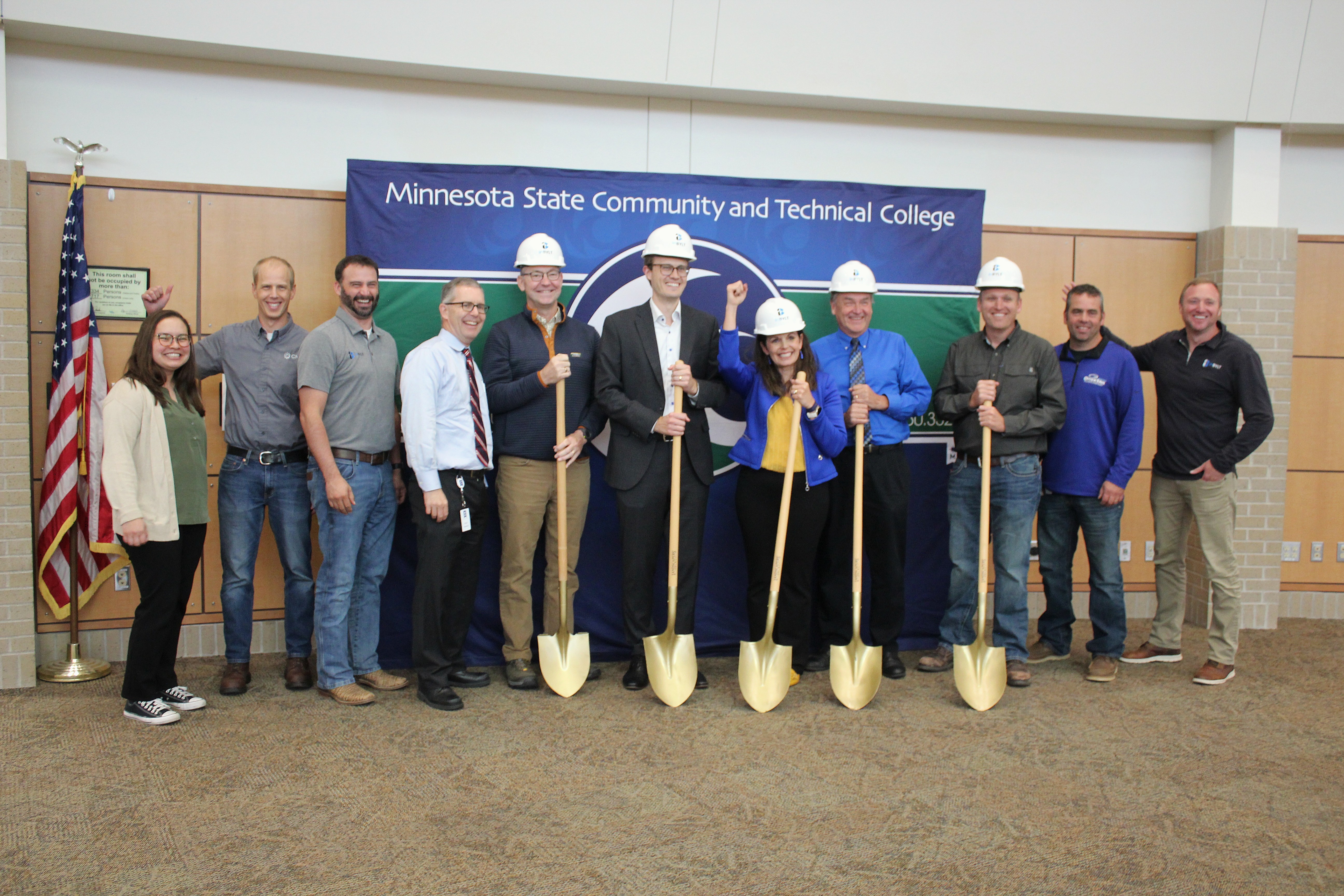 About 50 representatives of M State, the Minnesota State system, and project partners attended the ceremonial groundbreaking at M State’s Fergus Falls campus, including, left to right: inBYLT Development and Design Engineer Jeanessa Slaughter, CMTA Senior Mechanical Engineer Steve Hoepfner, inBYLT Senior Project Manager Nate Schoenecker, Minnesota State system Vice Chancellor of Facilities Brian Swanson, Minnesota State system Construction Project Manager Ryan Gideon, Senator Jordan Rasmusson, M State President Carrie Brimhall, M State Vice President of Finance and Facilities Pat Nordick, M State Building Maintenance Supervisor Dereck Houge, Otter Tail Power Company Energy Management Representative Bill Gronwold, and inBYLT Vice President Cody Capra.