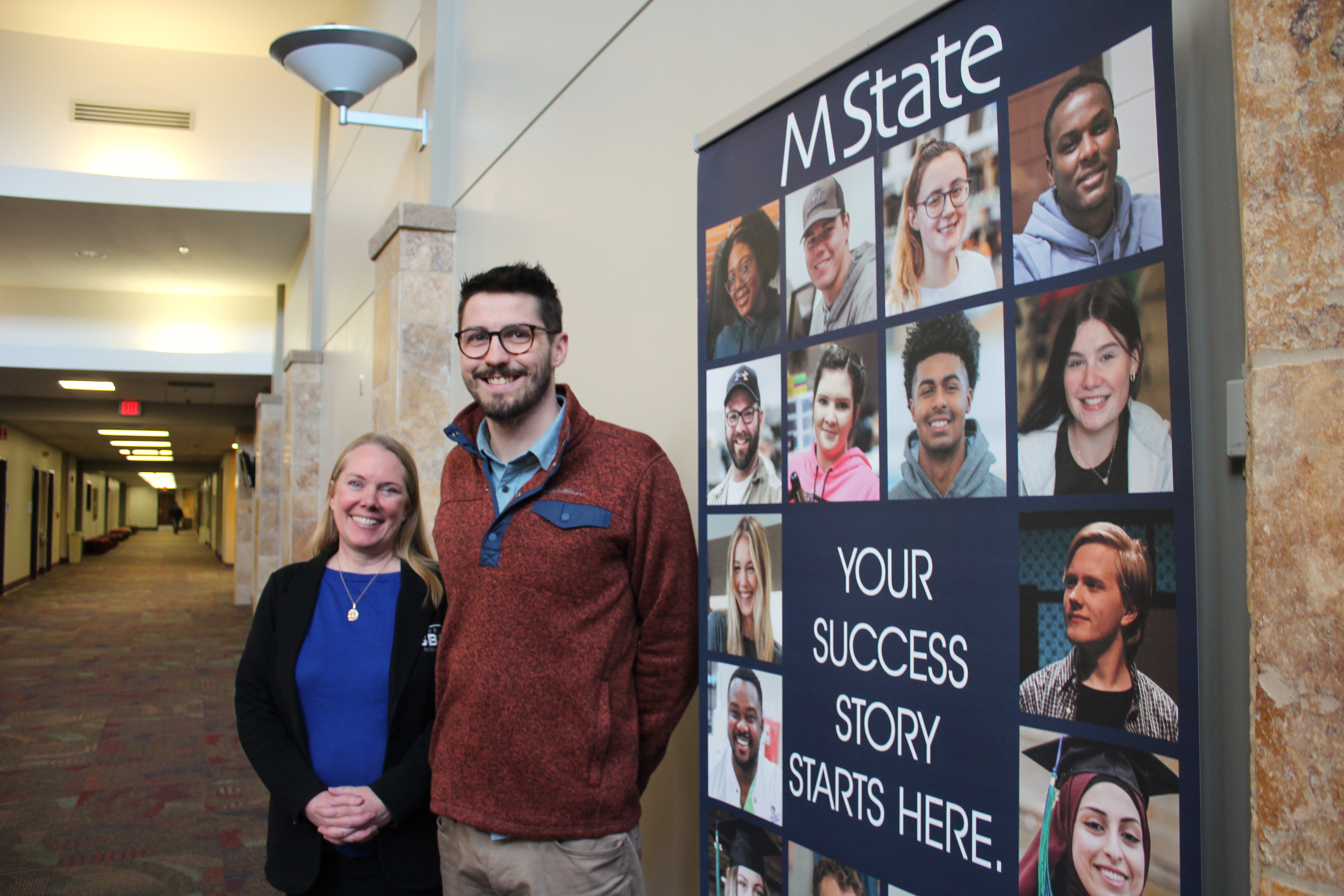 Amy Anderson and Ian Carlstrom, of the West Central Minnesota SBDC, pose for a picture outside their office on M State's Moorhead campus.