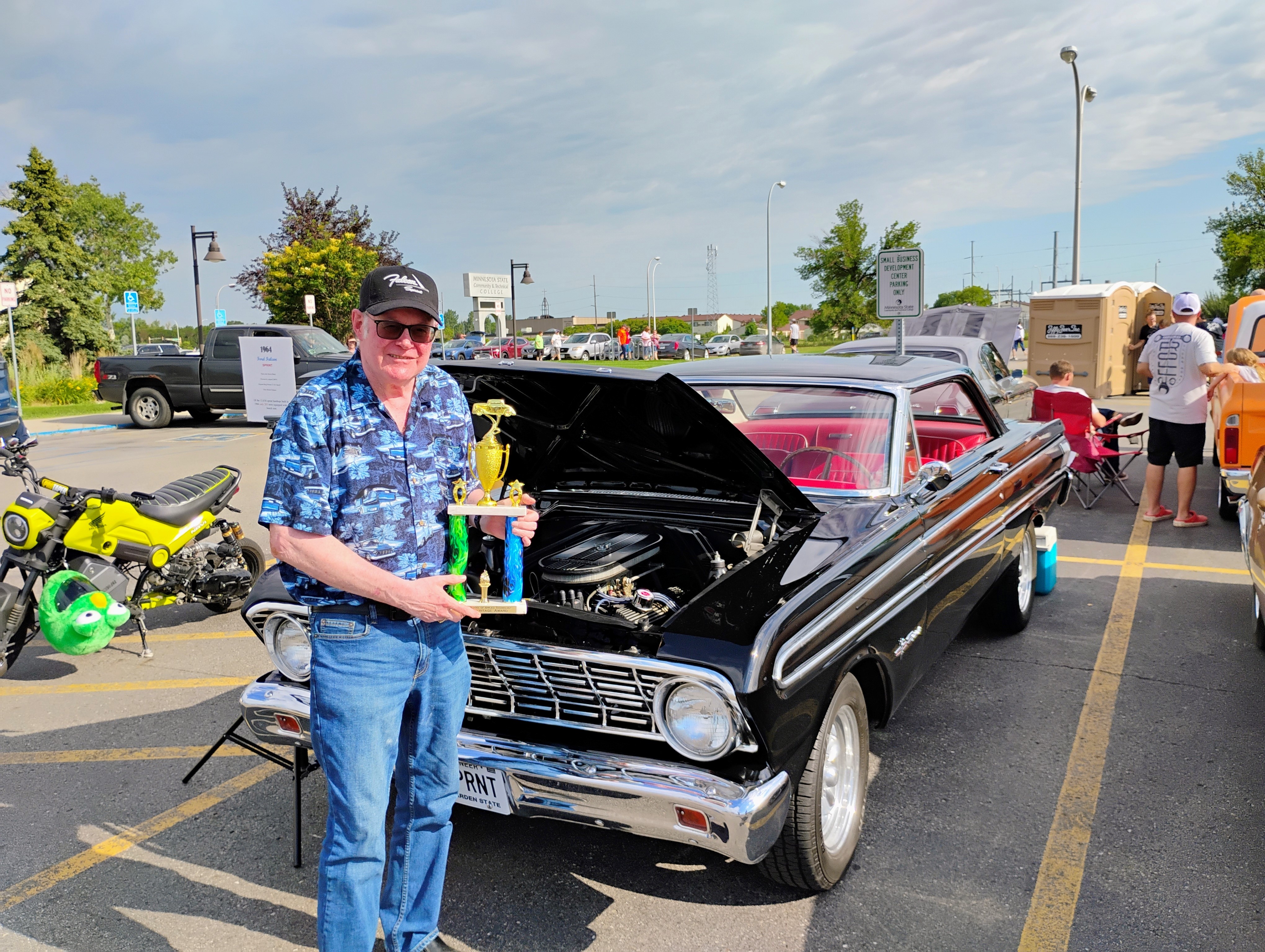 Robert Berry, the first winner of the M State SOAT Auto Heritage Award, with his winning 1964 Ford Falcon Sprint at Moorhead Cruise Night in May.