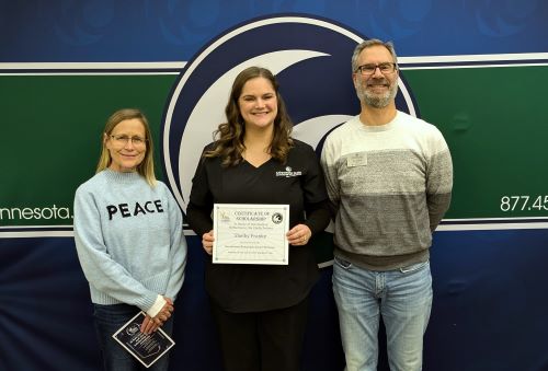 'Realize Your Dream' scholarship committee members Tom Dubbels, right, a counselor at M State, and Kim Gould, left, associate registrar at M State, with M State student Shelby Franke, a fall 2024 recipient of the scholarship.