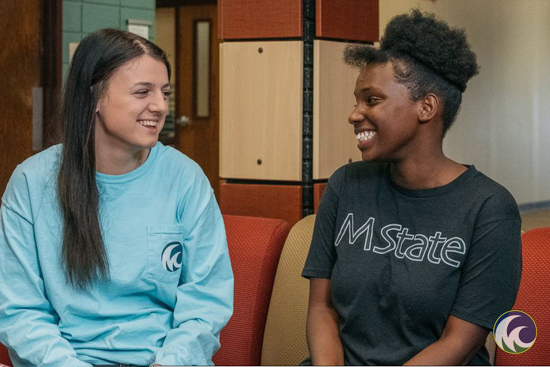 two students look at each other