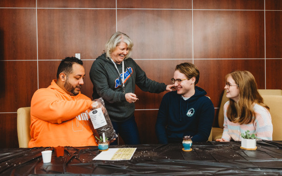 Photo of a small group of people at a succulent planting event