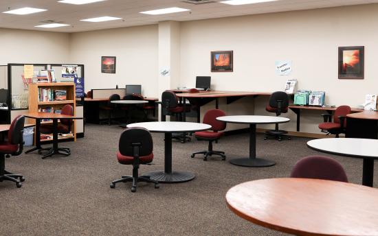 Several round tables where students can study or get academic assistance