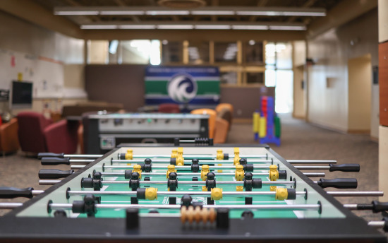 A foosball table in the student commons