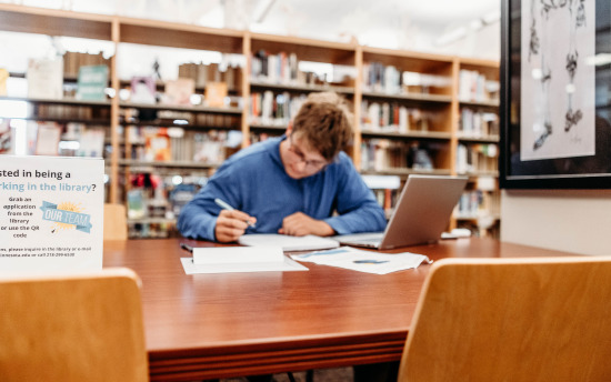 A student studying in the library