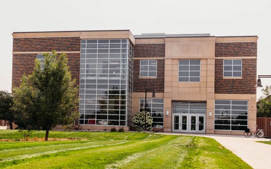 exterior photo of M State-Moorhead, showcasing the brick building with many windows