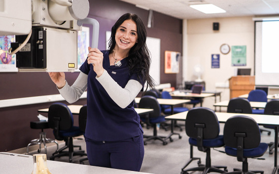 A radiology student practices x-rays