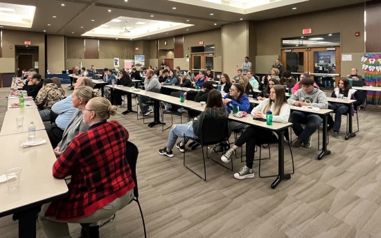 Minnesota Works 2024 students seated in a conference room at the Moorhead campus