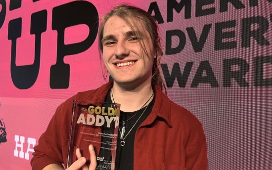 M State graphic design student Damon Lanoue, with his Gold ADDY award.