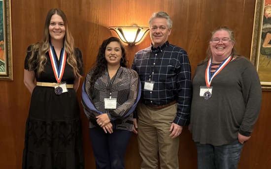 M State PTK All-Minnesota Academic Team honorees Leah Kunde, far left, and Nicole Sorby, far right, with chapter advisor Asenath Huether and Dean of Student Affairs Scott Ebsen at the PTK luncheon in April 2026.