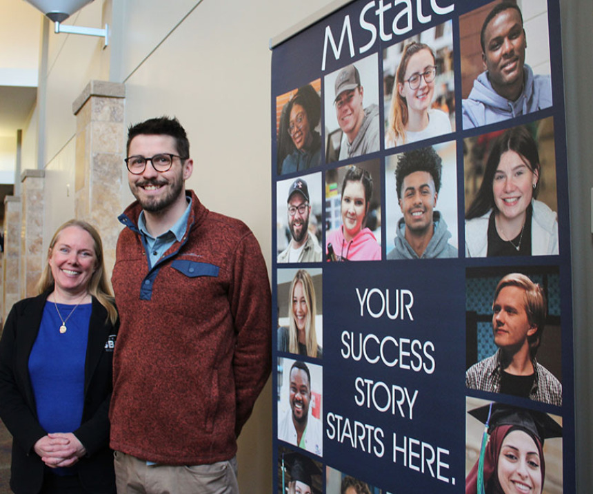 SBDC personnel stand by an M State sign