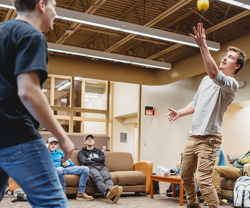 Students play a game in a Wadena campus lounge