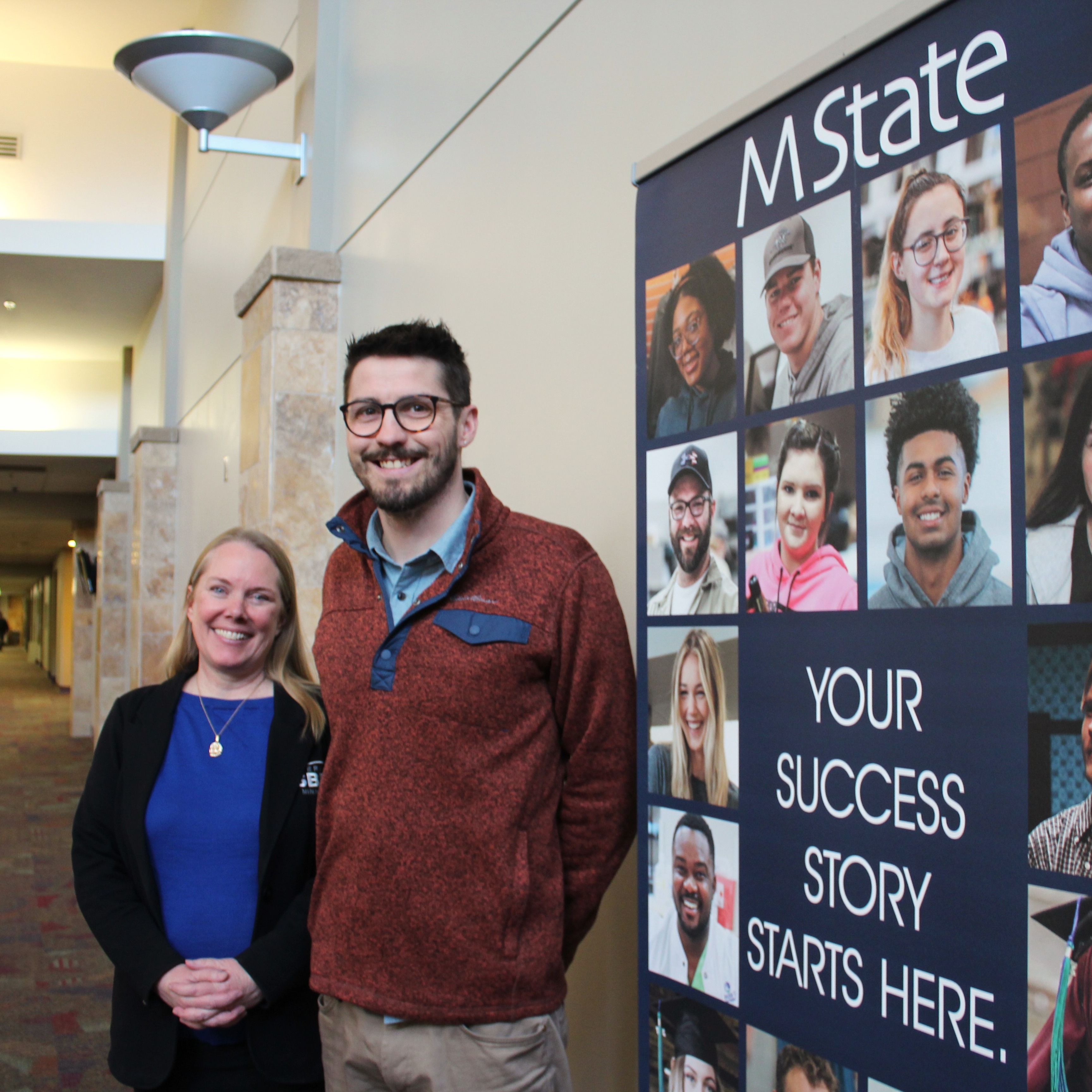 Amy Anderson and Ian Carlstrom, of the West Central Minnesota SBDC, pose for a picture outside their office on M State's Moorhead campus.