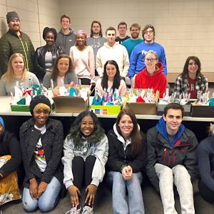 Accounting students assemble care kits