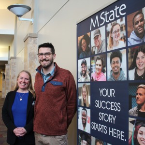 Amy Anderson and Ian Carlstrom, of the West Central Minnesota SBDC, pose for a picture outside their office on M State's Moorhead campus.